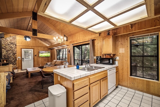 3700 Glen Lake Rd, Eureka, MT 59917 - kitchen with open floor plan, dishwasher, wood walls, light tile patterned flooring, and black microwave