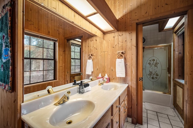 3700 Glen Lake Rd, Eureka, MT 59917 - full bath featuring shower / bath combination with glass door, tile patterned floors, double vanity, wooden walls, and lofted ceiling