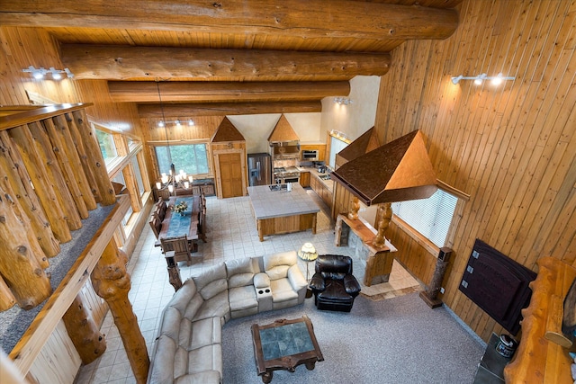 3700 Glen Lake Rd, Eureka, MT 59917 - living room featuring wooden walls and a wood ceiling with exposed beams