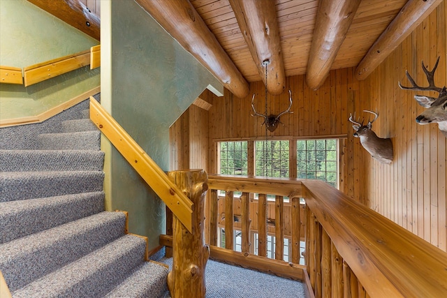 3700 Glen Lake Rd, Eureka, MT 59917 - stairs with carpet, a wooden ceiling with exposed beams, and wood walls