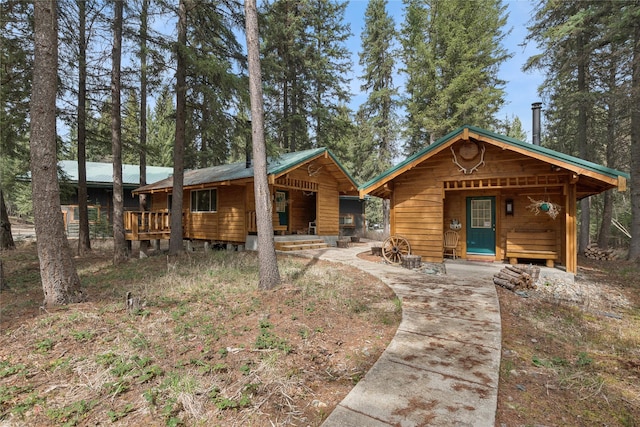 3700 Glen Lake Rd, Eureka, MT 59917 - view of front of property featuring a porch and a metal roof