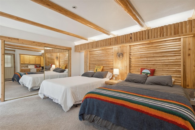 3700 Glen Lake Rd, Eureka, MT 59917 - carpeted bedroom with beam ceiling and rustic walls
