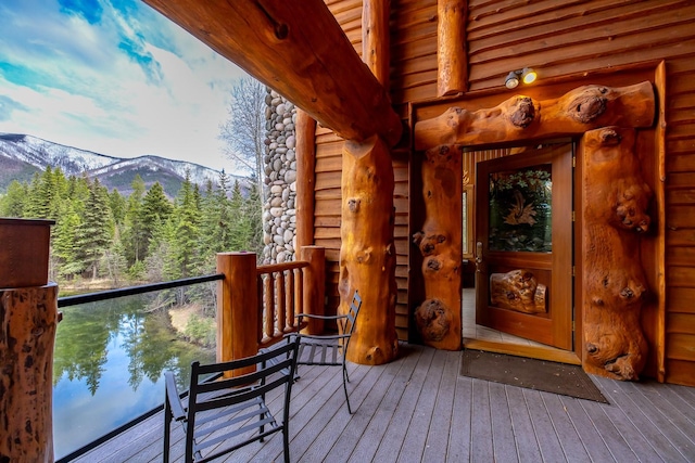 3700 Glen Lake Rd, Eureka, MT 59917 - view of exterior entry featuring a mountain view, log exterior, and a balcony