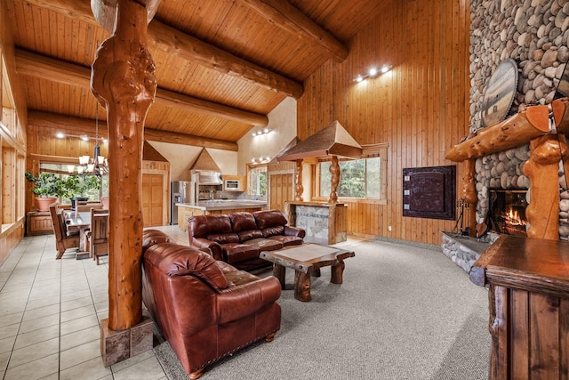 3700 Glen Lake Rd, Eureka, MT 59917 - living area with a fireplace, a wooden ceiling with exposed beams, healthy amount of natural light, wood walls, and a chandelier