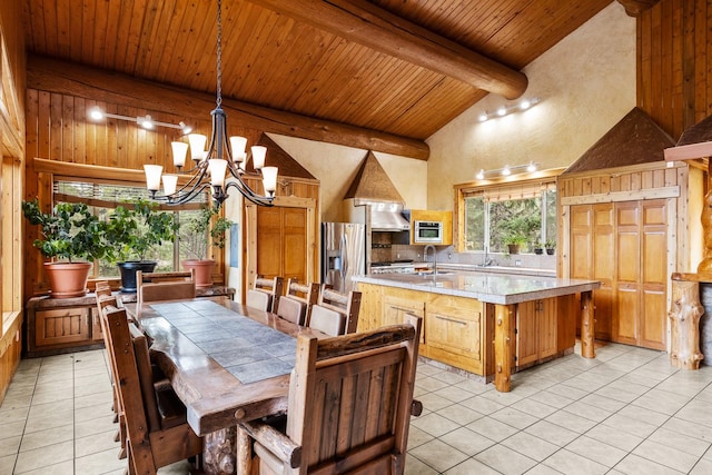 3700 Glen Lake Rd, Eureka, MT 59917 - dining room with light tile patterned floors, a chandelier, high vaulted ceiling, and a wooden ceiling with exposed beams
