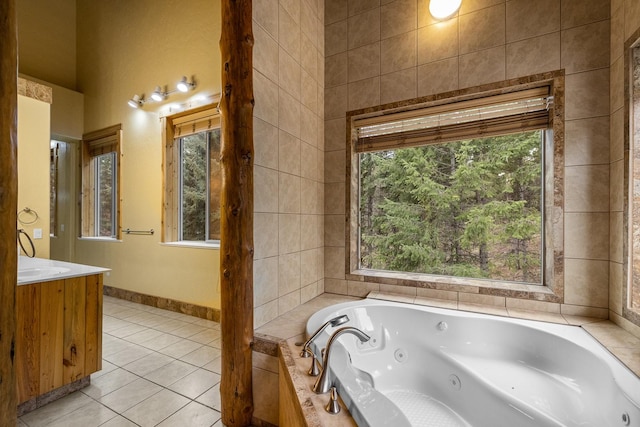 3700 Glen Lake Rd, Eureka, MT 59917 - bathroom with vanity, a tub with jets, and tile patterned flooring