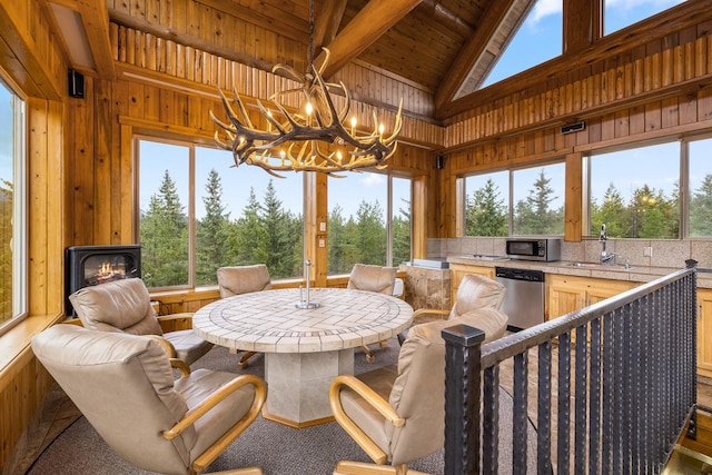 3700 Glen Lake Rd, Eureka, MT 59917 - sunroom featuring a chandelier and a sink