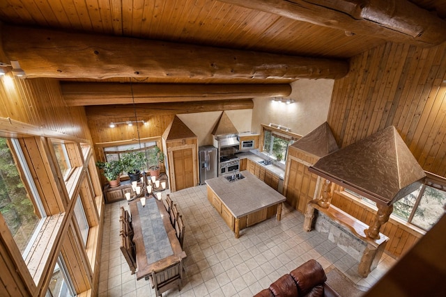 3700 Glen Lake Rd, Eureka, MT 59917 - living room with wooden walls, a wooden ceiling with exposed beams, and light tile patterned flooring