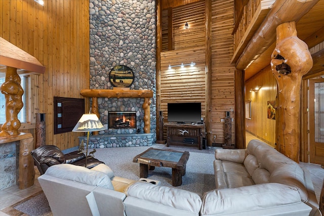 3700 Glen Lake Rd, Eureka, MT 59917 - living area featuring wooden walls, a high ceiling, and a fireplace