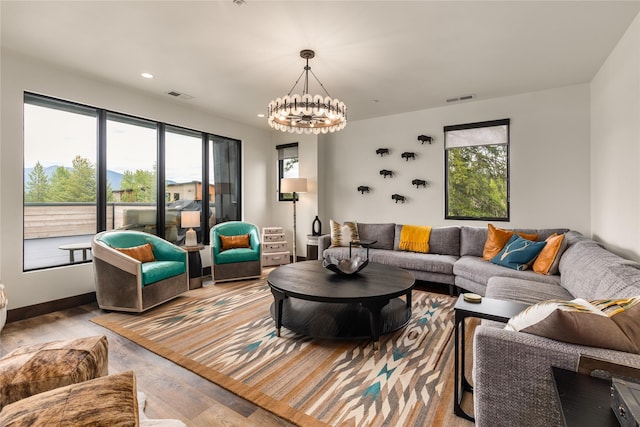 317 Akers Ln Unit H, Whitefish, MT 59937 - living room featuring wood finished floors, a chandelier, and recessed lighting