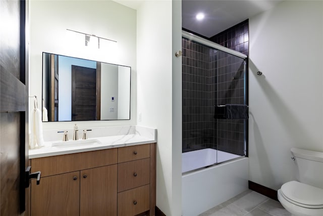 317 Akers Ln Unit H, Whitefish, MT 59937 - bathroom featuring toilet, vanity, enclosed tub / shower combo, baseboards, and tile patterned flooring