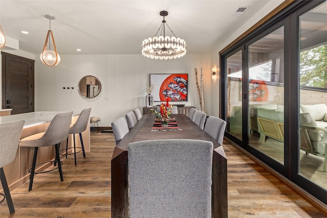 317 Akers Ln Unit H, Whitefish, MT 59937 - dining room featuring wood finished floors, a chandelier, and recessed lighting