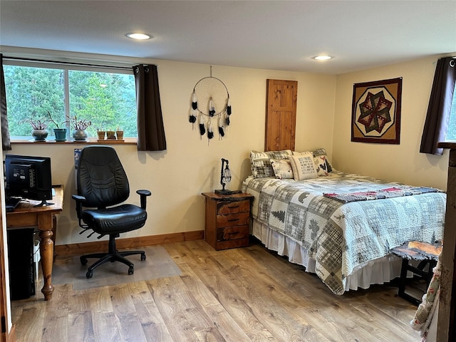 85 Osprey Dr E, Thompson Falls, MT 59873 - bedroom featuring wood finished floors, baseboards, and recessed lighting