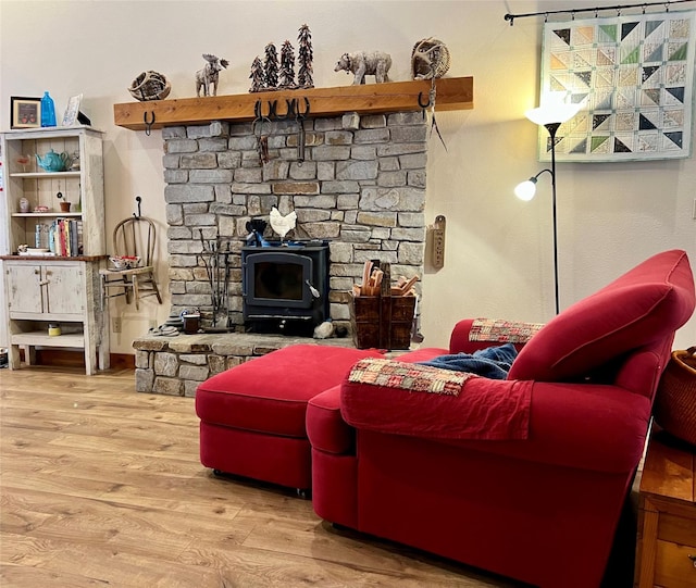 85 Osprey Dr E, Thompson Falls, MT 59873 - living room featuring wood finished floors and a wood stove