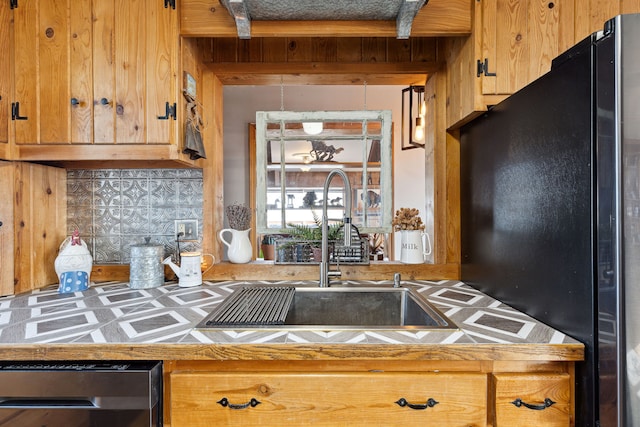 44688 N Foothills Dr, Ronan, MT 59864 - kitchen with freestanding refrigerator, a sink, and tile countertops