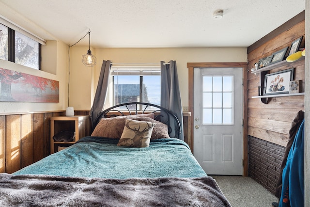 44688 N Foothills Dr, Ronan, MT 59864 - carpeted bedroom with wooden walls and multiple windows