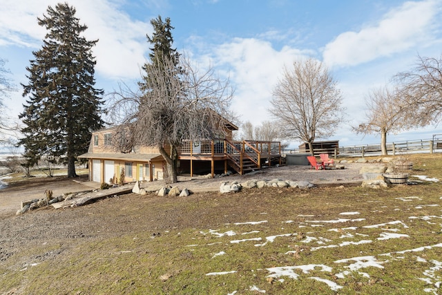44688 N Foothills Dr, Ronan, MT 59864 - rear view of house featuring fence, a deck, and a garage