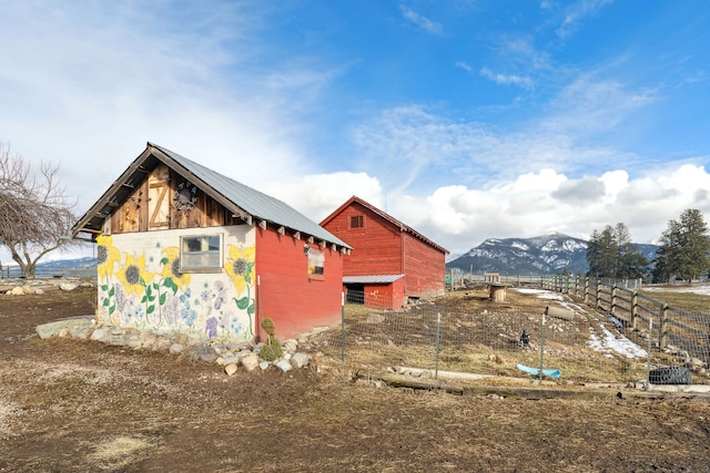 44688 N Foothills Dr, Ronan, MT 59864 - view of outbuilding with fence, an outdoor structure, and a mountain view