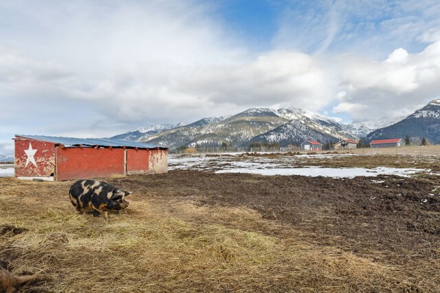 44688 N Foothills Dr, Ronan, MT 59864 - view of yard with a mountain view, a pole building, and an outdoor structure