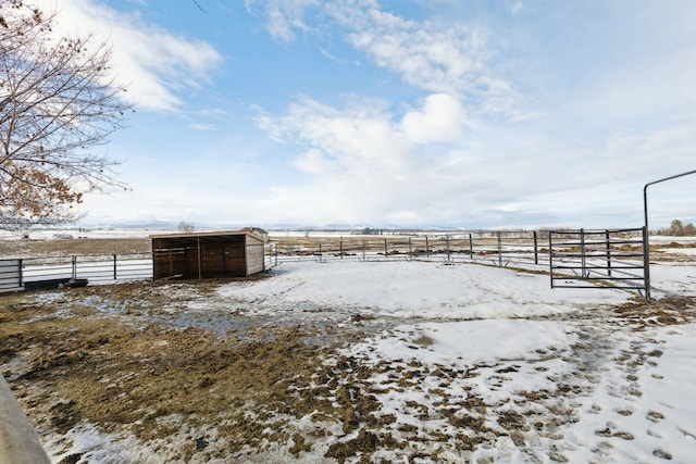 44688 N Foothills Dr, Ronan, MT 59864 - yard layered in snow featuring fence, an outbuilding, and an exterior structure