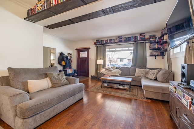 living room featuring crown molding and dark wood finished floors