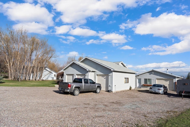 385 Meadow Hills Dr, Kalispell, MT 59901 - ranch-style home featuring driveway and an outdoor structure