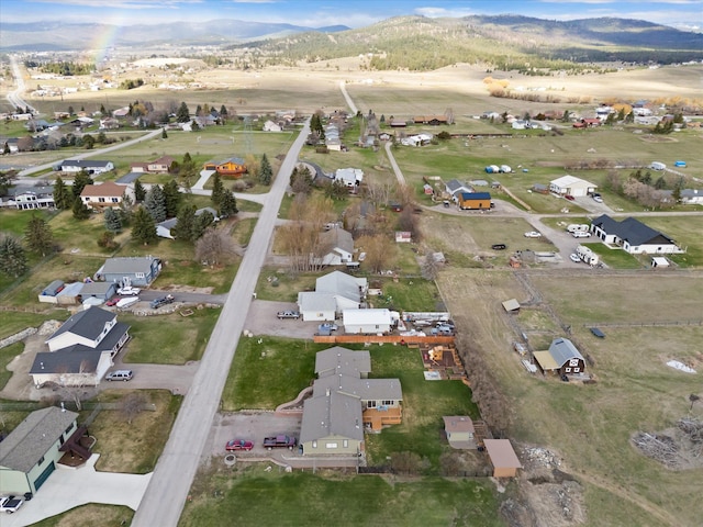 385 Meadow Hills Dr, Kalispell, MT 59901 - aerial view of property's location with a mountainous background and nearby suburban area