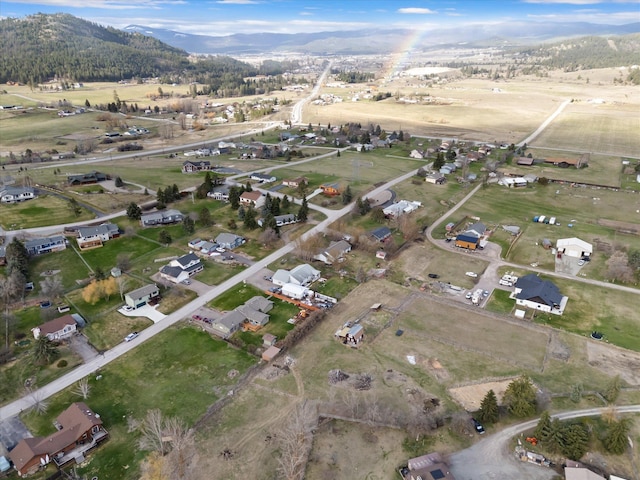 385 Meadow Hills Dr, Kalispell, MT 59901 - aerial view of property's location featuring a mountain backdrop