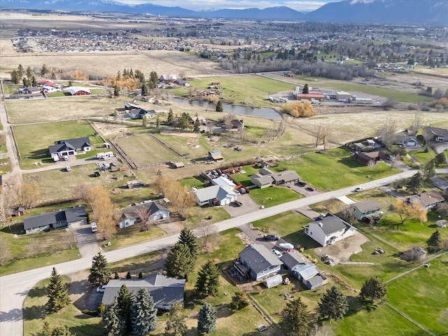 385 Meadow Hills Dr, Kalispell, MT 59901 - aerial view of property and surrounding area with a water and mountain view and nearby suburban area