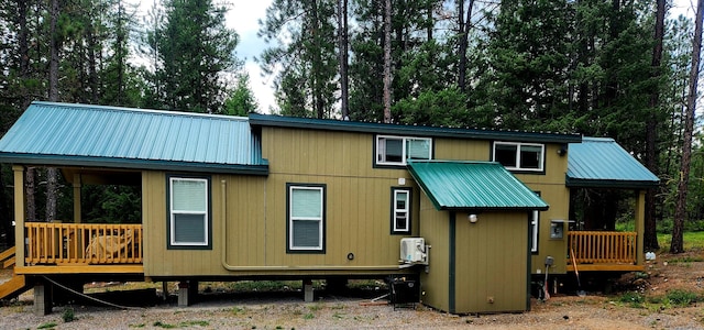 20795 Whispering Pines Rd, Missoula, MT 59808 - back of property with a metal roof and a wooden deck