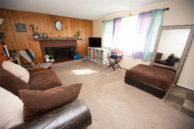 1428 Wilson Ave, Havre, MT 59501 - carpeted living room with wooden walls and a fireplace