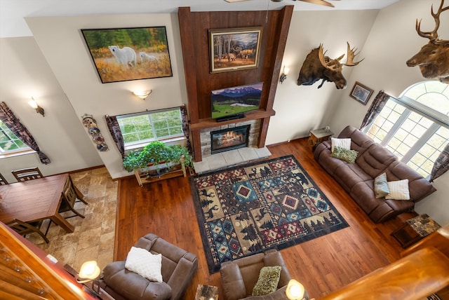 8 Primrose Ct, Kalispell, MT 59901 - living room with a tile fireplace, a ceiling fan, and wood finished floors