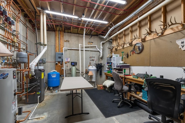 8 Primrose Ct, Kalispell, MT 59901 - unfinished basement with gas water heater, a water pressure tank, a workshop area, a heating unit, and electric panel