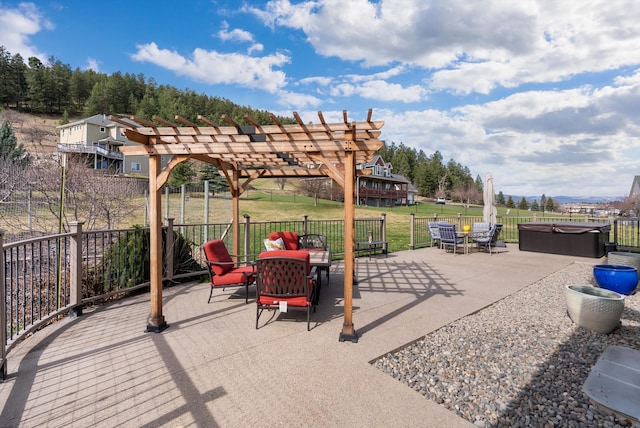 8 Primrose Ct, Kalispell, MT 59901 - view of patio featuring a hot tub, a pergola, and outdoor dining area