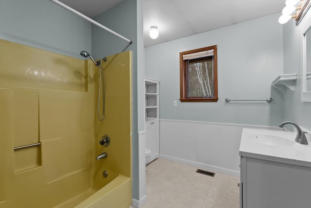 220 Ferndale Dr, Bigfork, MT 59911 - bathroom featuring vanity, shower / bathtub combination, and wainscoting