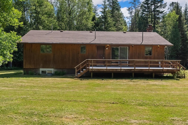 220 Ferndale Dr, Bigfork, MT 59911 - rear view of house featuring a yard and a wooden deck