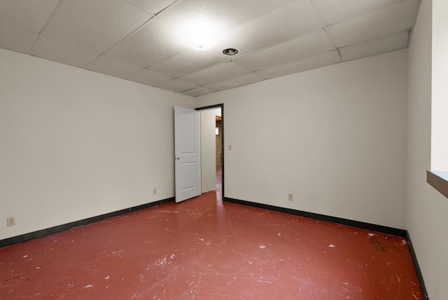 220 Ferndale Dr, Bigfork, MT 59911 - unfurnished room with a paneled ceiling and finished concrete flooring