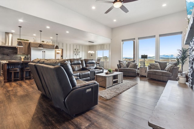 2650 W Valley Dr, Kalispell, MT 59901 - living area featuring baseboards, dark wood-style flooring, a stone fireplace, and ceiling fan