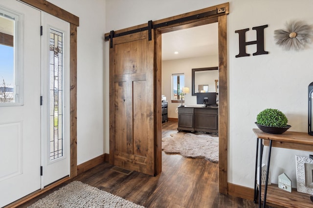 2650 W Valley Dr, Kalispell, MT 59901 - bedroom featuring a ceiling fan, a barn door, recessed lighting, baseboards, and dark wood finished floors