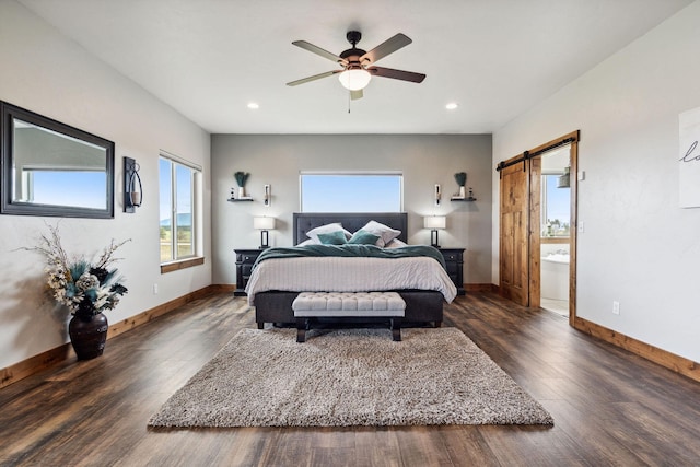 2650 W Valley Dr, Kalispell, MT 59901 - bedroom featuring dark wood finished floors, a barn door, baseboards, and recessed lighting