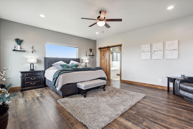 2650 W Valley Dr, Kalispell, MT 59901 - bedroom featuring a barn door, wood finished floors, baseboards, and recessed lighting