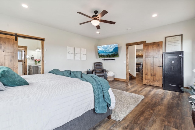 2650 W Valley Dr, Kalispell, MT 59901 - bedroom featuring a sink, connected bathroom, and a barn door