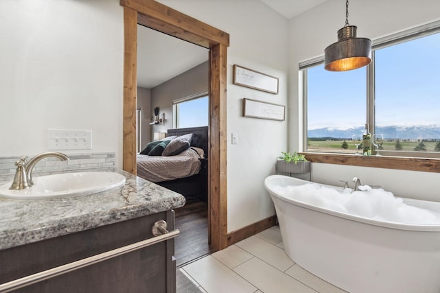 2650 W Valley Dr, Kalispell, MT 59901 - full bathroom featuring a stall shower, baseboards, tile patterned floors, and a freestanding bath
