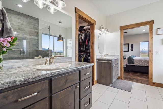 2650 W Valley Dr, Kalispell, MT 59901 - bathroom featuring ensuite bathroom, toilet, a stall shower, baseboards, and tile patterned flooring
