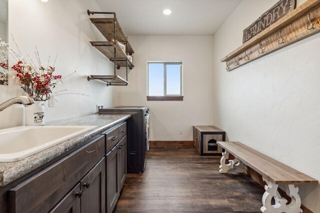 2650 W Valley Dr, Kalispell, MT 59901 - laundry area featuring a sink, washer / clothes dryer, dark wood-style flooring, and laundry area