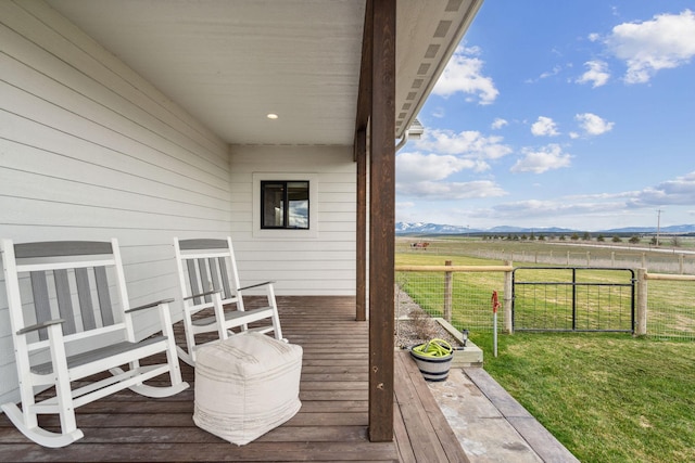2650 W Valley Dr, Kalispell, MT 59901 - view of side of home featuring stairs, a mountain view, and fence