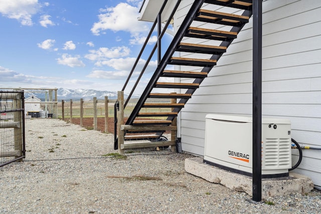 2650 W Valley Dr, Kalispell, MT 59901 - view of side of property featuring stairway, fence, and ac unit