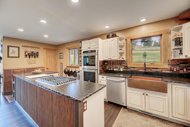 5 Alpine Valley Ln, Clancy, MT 59634 - kitchen with appliances with stainless steel finishes, open shelves, wood finished floors, a center island, and recessed lighting