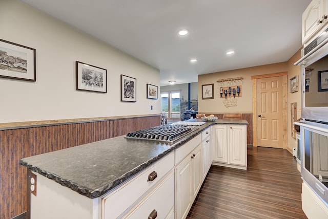5 Alpine Valley Ln, Clancy, MT 59634 - kitchen with appliances with stainless steel finishes, recessed lighting, dark wood-type flooring, white cabinetry, and a kitchen island