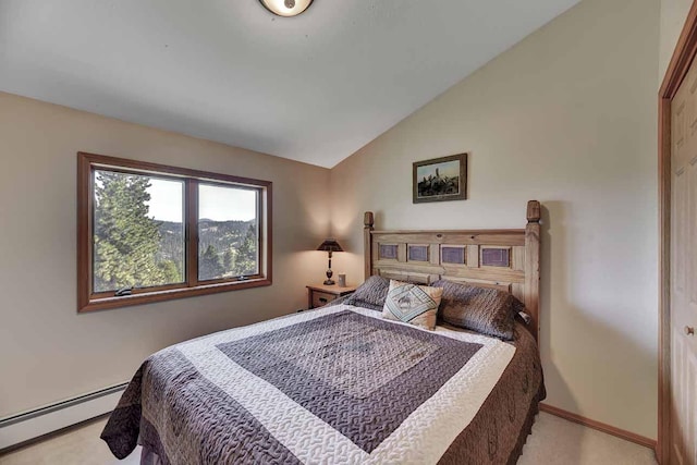 5 Alpine Valley Ln, Clancy, MT 59634 - bedroom featuring a baseboard radiator, lofted ceiling, and light carpet